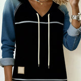 Prugasta haljina s kapuljačom u kombinaciji boja