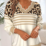 Džemper s leopard uzorkom i kontrastnim V-izrezom